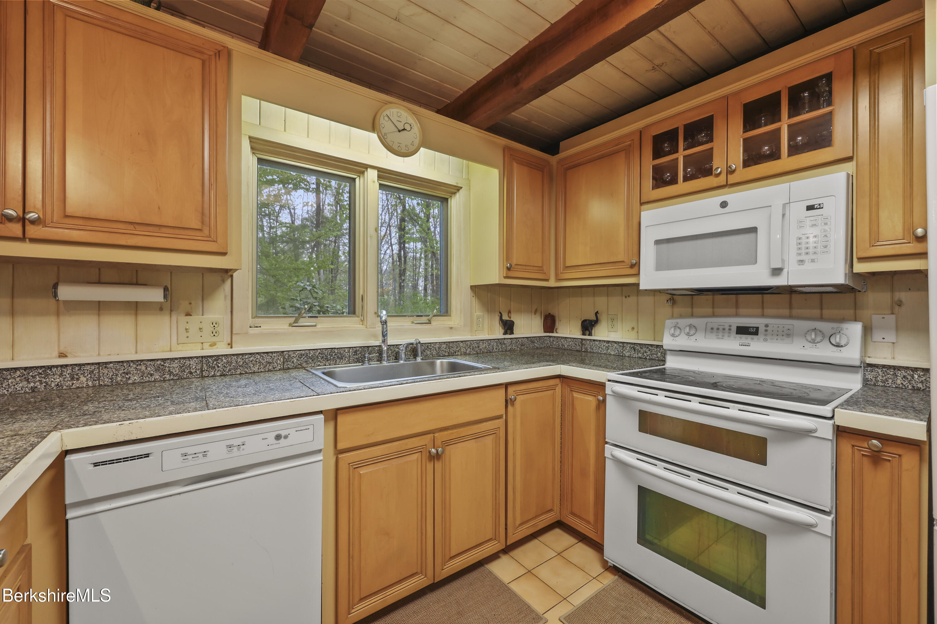 422 Bonny Rigg Hill Road Becket, MA 01223 - Photo 13 of 60 a kitchen with stainless steel appliances granite countertop a sink a stove and cabinets