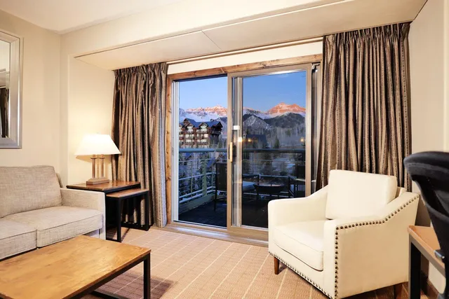 a living room with a couch and a table