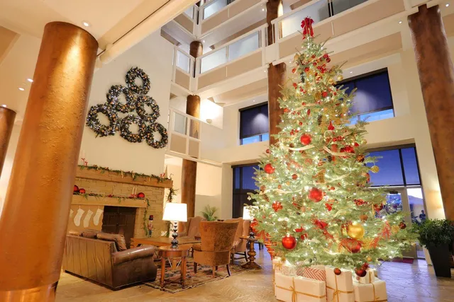 a living room with a fireplace and wooden floor