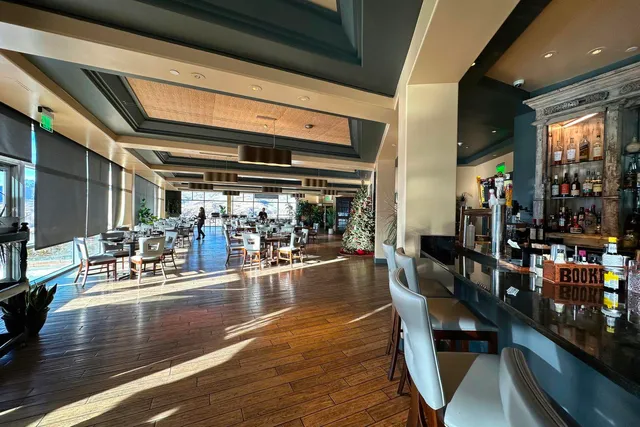 a view of a dining room with lots of tables and chairs