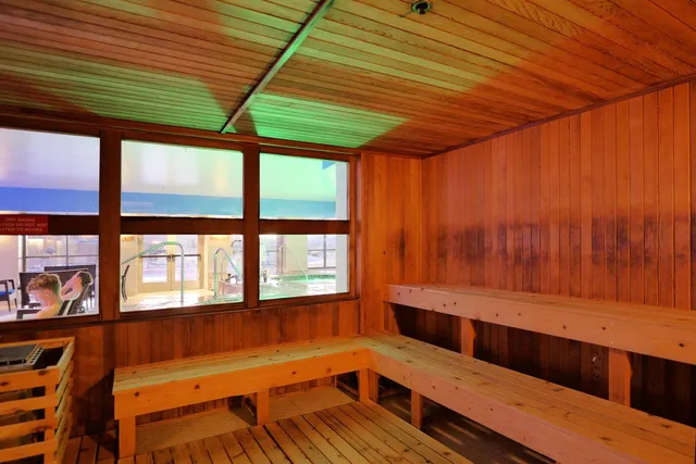 a view of wooden floor and a window