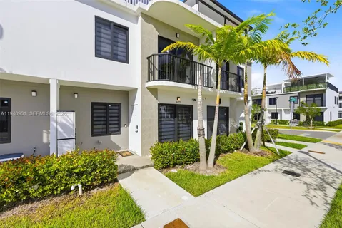 a view of a building with a yard