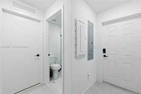 a bathroom with a granite countertop sink