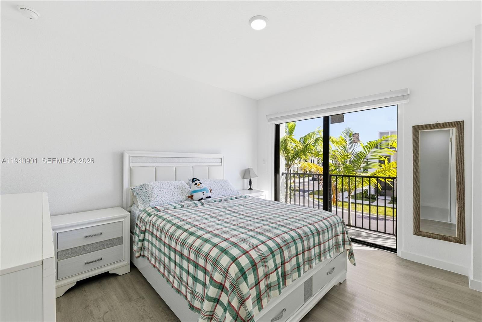 26122 Southwest 145th Court Homestead, FL 33033 - Photo 21 of 54 a bedroom with a bed and a large window