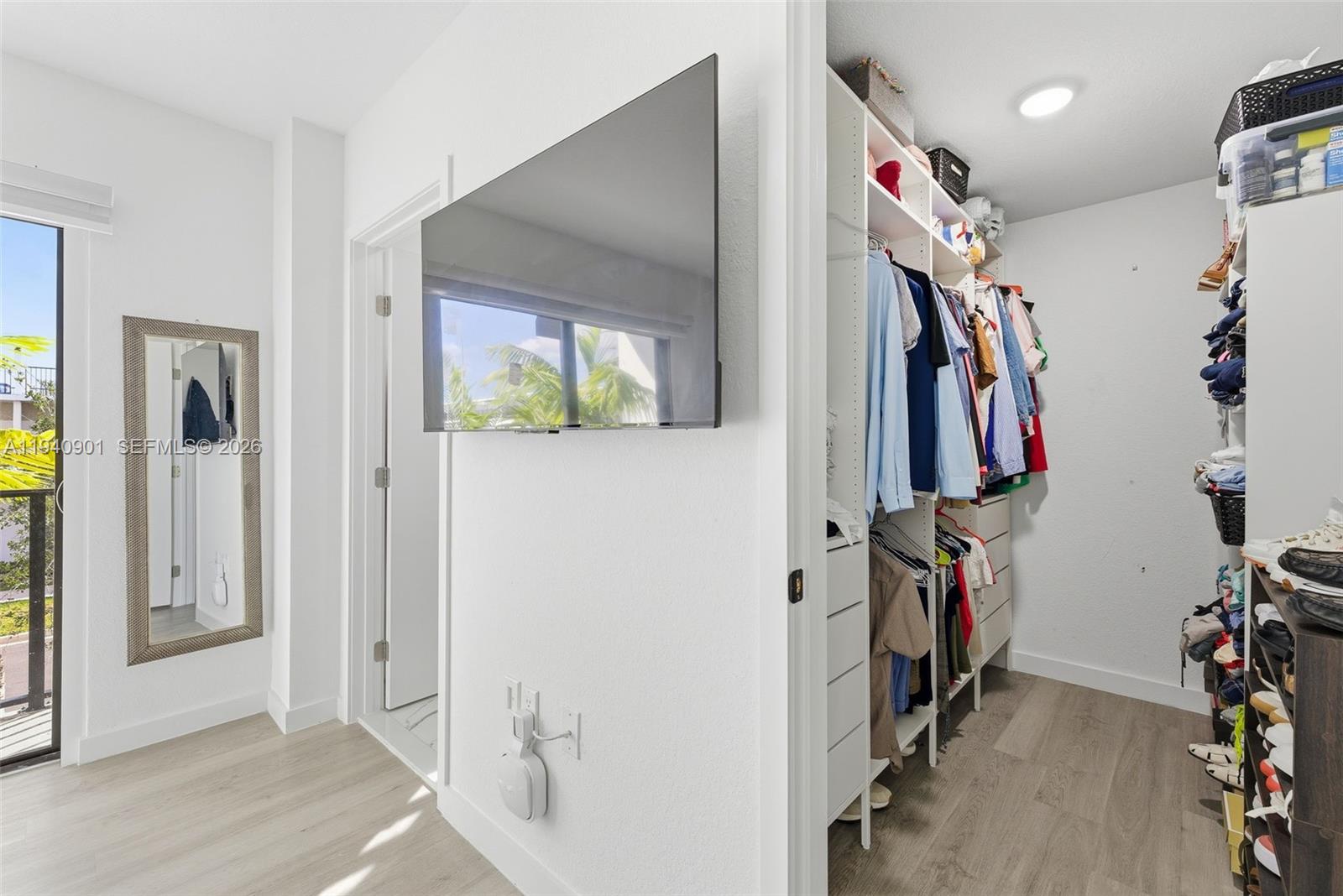 26122 Southwest 145th Court Homestead, FL 33033 - Photo 24 of 54 a view of a hallway with closet and a window