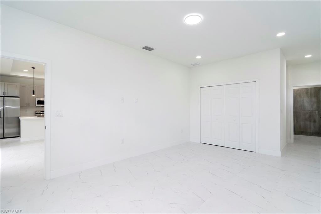 3810 29th Street Southwest Lehigh Acres, FL 33976 - Photo 16 of 48 an empty room with a bathroom