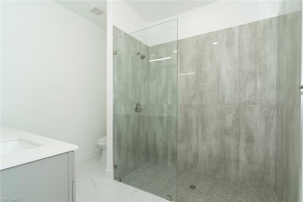 3810 29th Street Southwest Lehigh Acres, FL 33976 - Photo 19 of 48 a bathroom with a shower and a sink