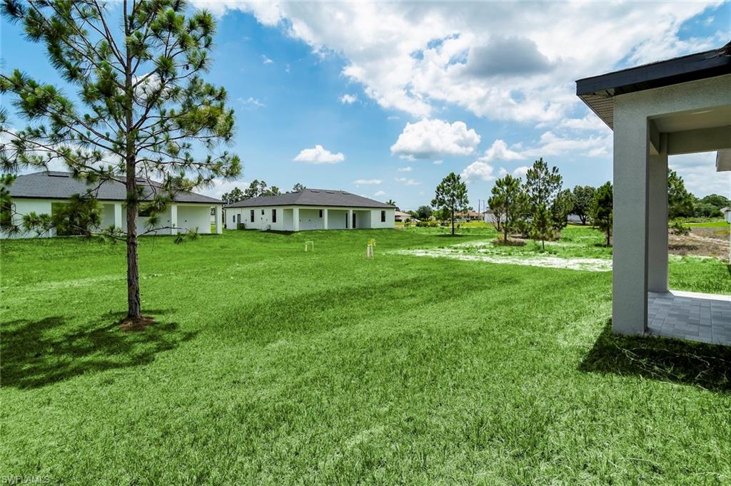 3810 29th Street Southwest Lehigh Acres, FL 33976 - Photo 27 of 48 a view of a house with a big yard