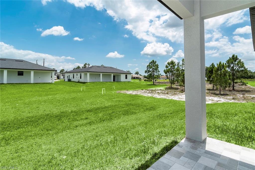 3810 29th Street Southwest Lehigh Acres, FL 33976 - Photo 28 of 48 a view of a house with a big yard