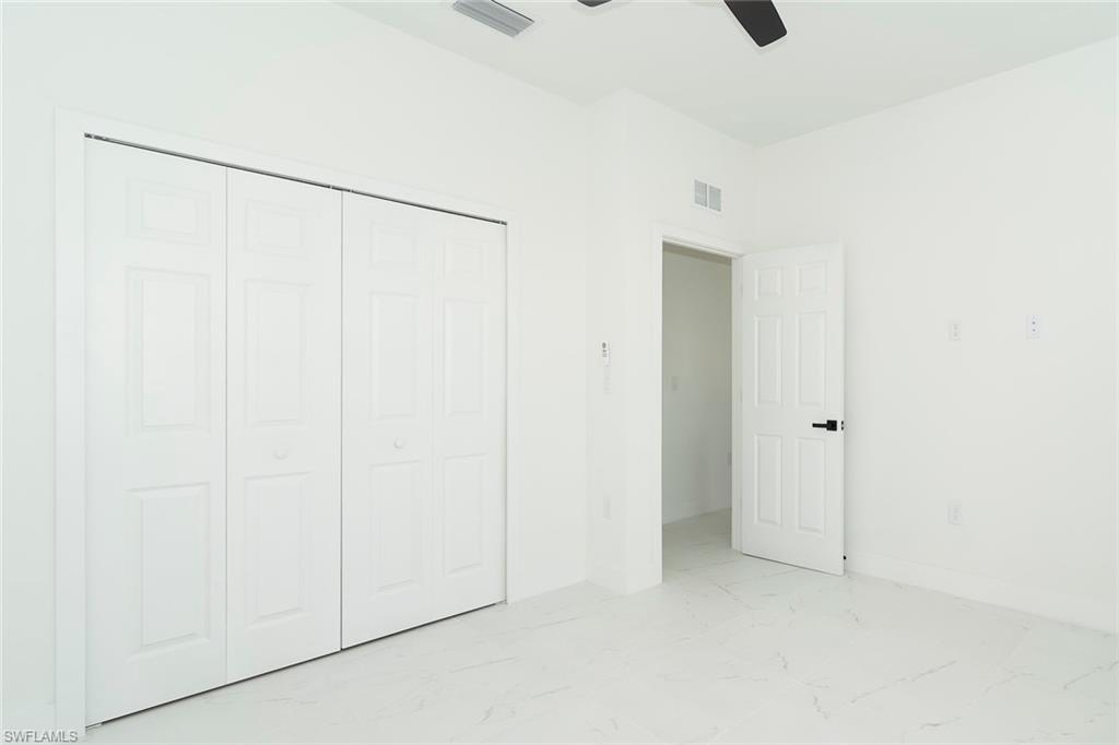 3810 29th Street Southwest Lehigh Acres, FL 33976 - Photo 36 of 48 a view of an empty room