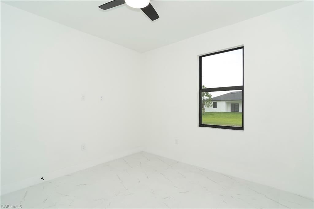 3810 29th Street Southwest Lehigh Acres, FL 33976 - Photo 37 of 48 a view of a small space with a window