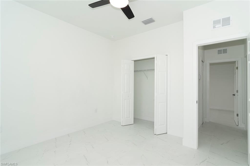 3810 29th Street Southwest Lehigh Acres, FL 33976 - Photo 38 of 48 an empty room with view and closet in it