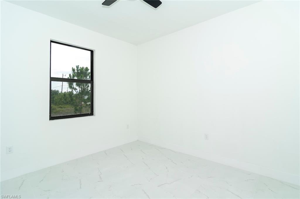 3810 29th Street Southwest Lehigh Acres, FL 33976 - Photo 39 of 48 a view of an empty room with a window