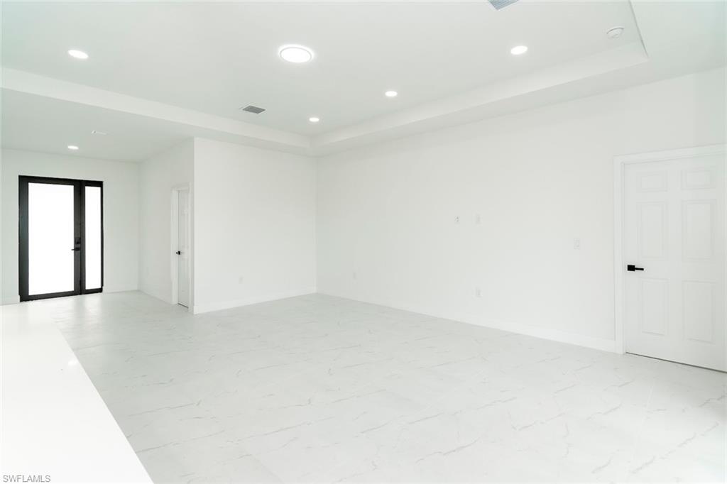 3810 29th Street Southwest Lehigh Acres, FL 33976 - Photo 8 of 48 an empty room with a natural light