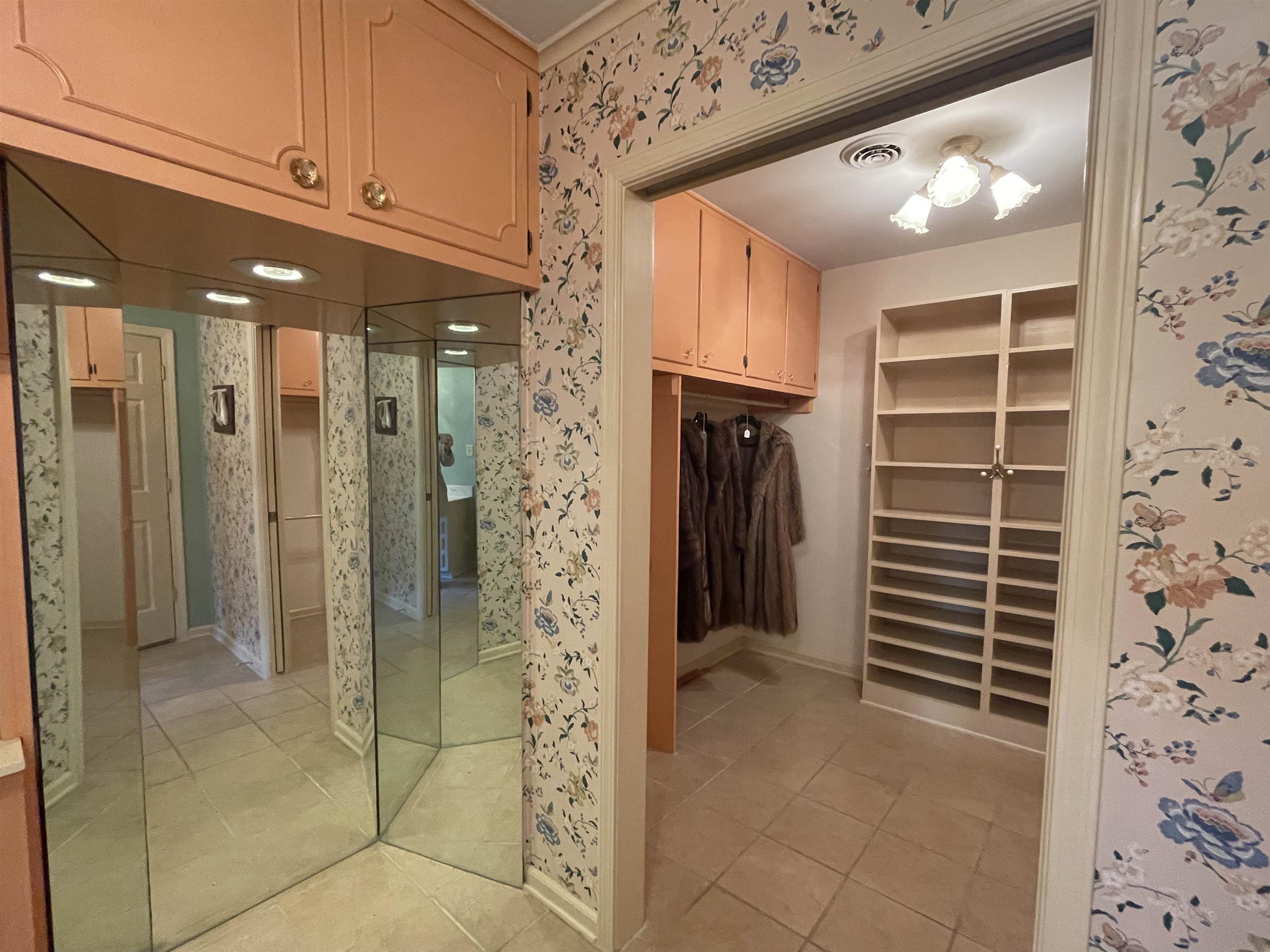 4477 Tall Trees Drive Memphis, TN 38117 - Photo 13 of 25 a view of walk in closet and bedroom