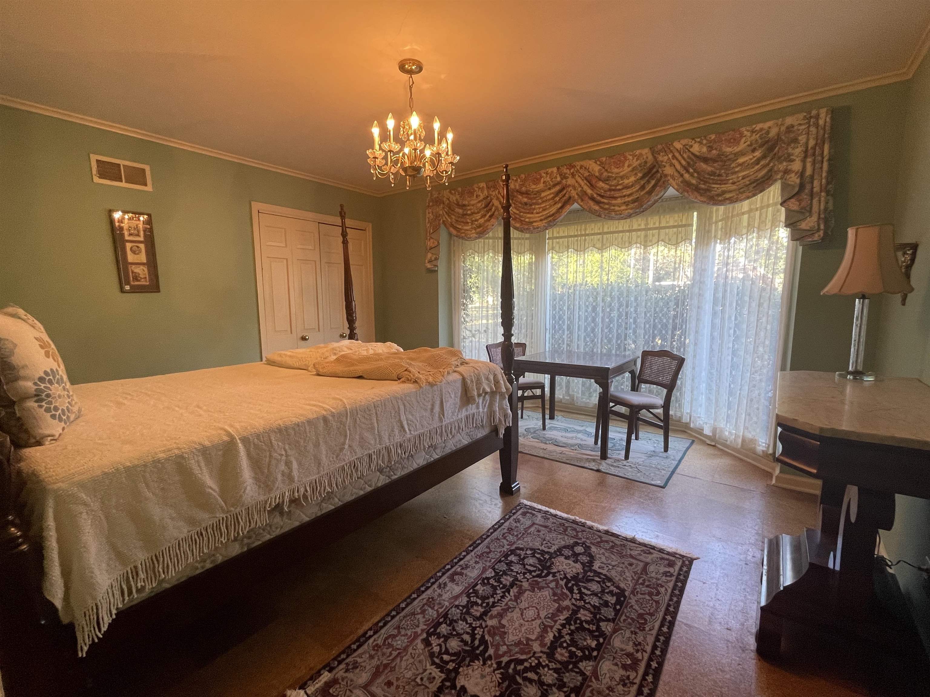 4477 Tall Trees Drive Memphis, TN 38117 - Photo 15 of 25 a bedroom with a bed a table and chair