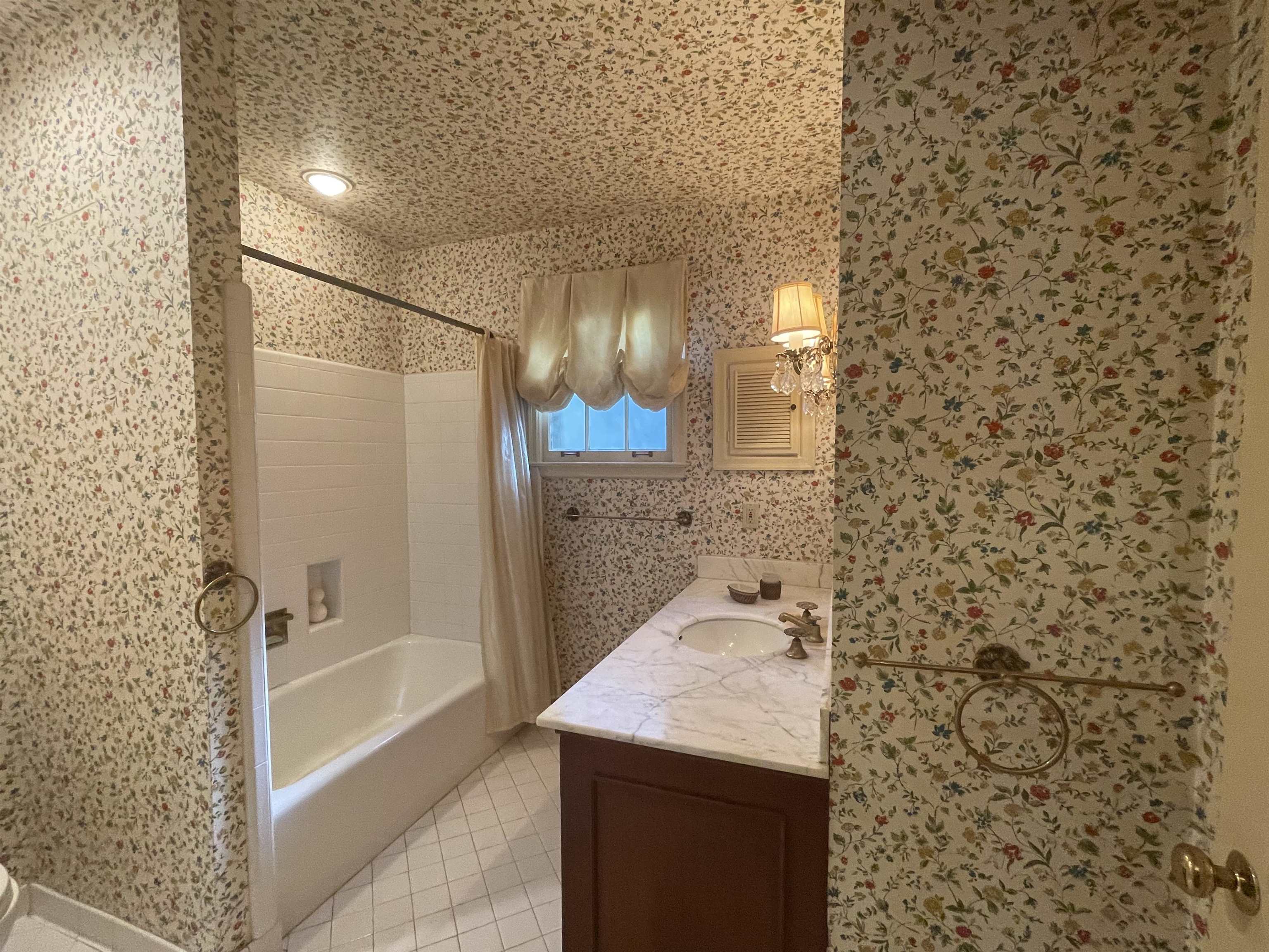4477 Tall Trees Drive Memphis, TN 38117 - Photo 16 of 25 a bathroom with a granite countertop sink a toilet and shower