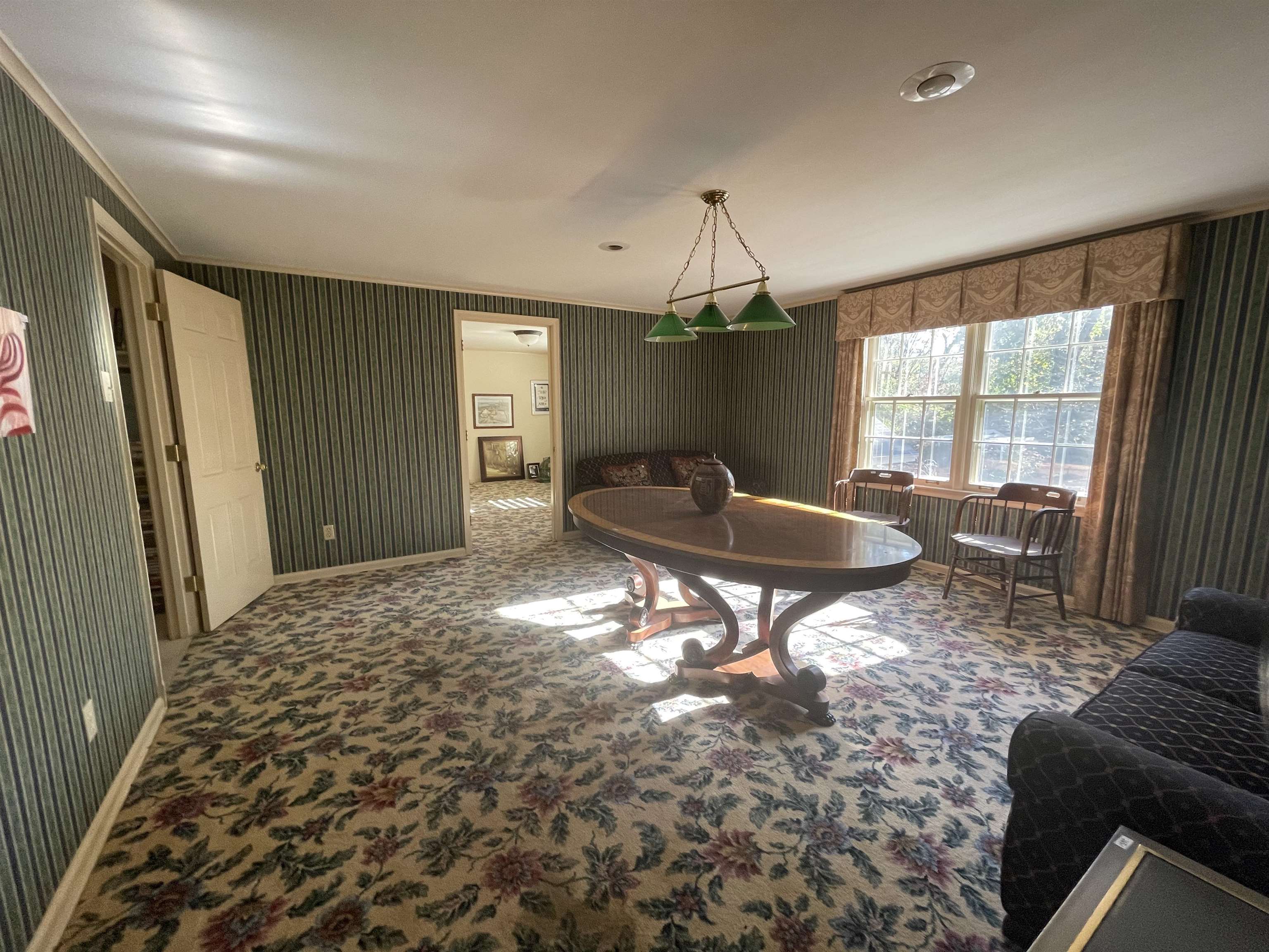 4477 Tall Trees Drive Memphis, TN 38117 - Photo 21 of 25 a living room with a couch and a table