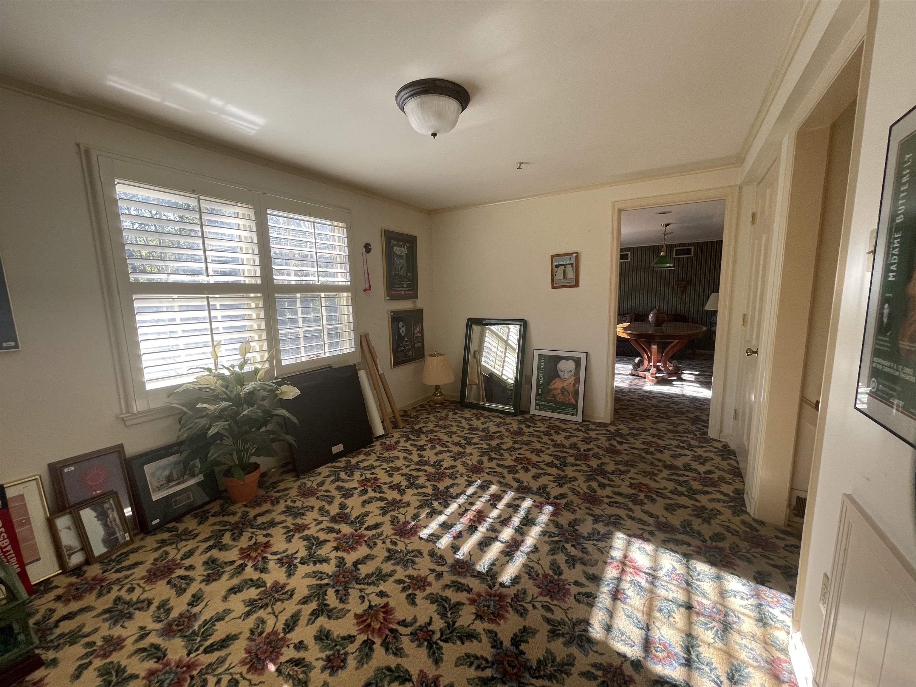 4477 Tall Trees Drive Memphis, TN 38117 - Photo 22 of 25 a bedroom with a bed and wooden floor