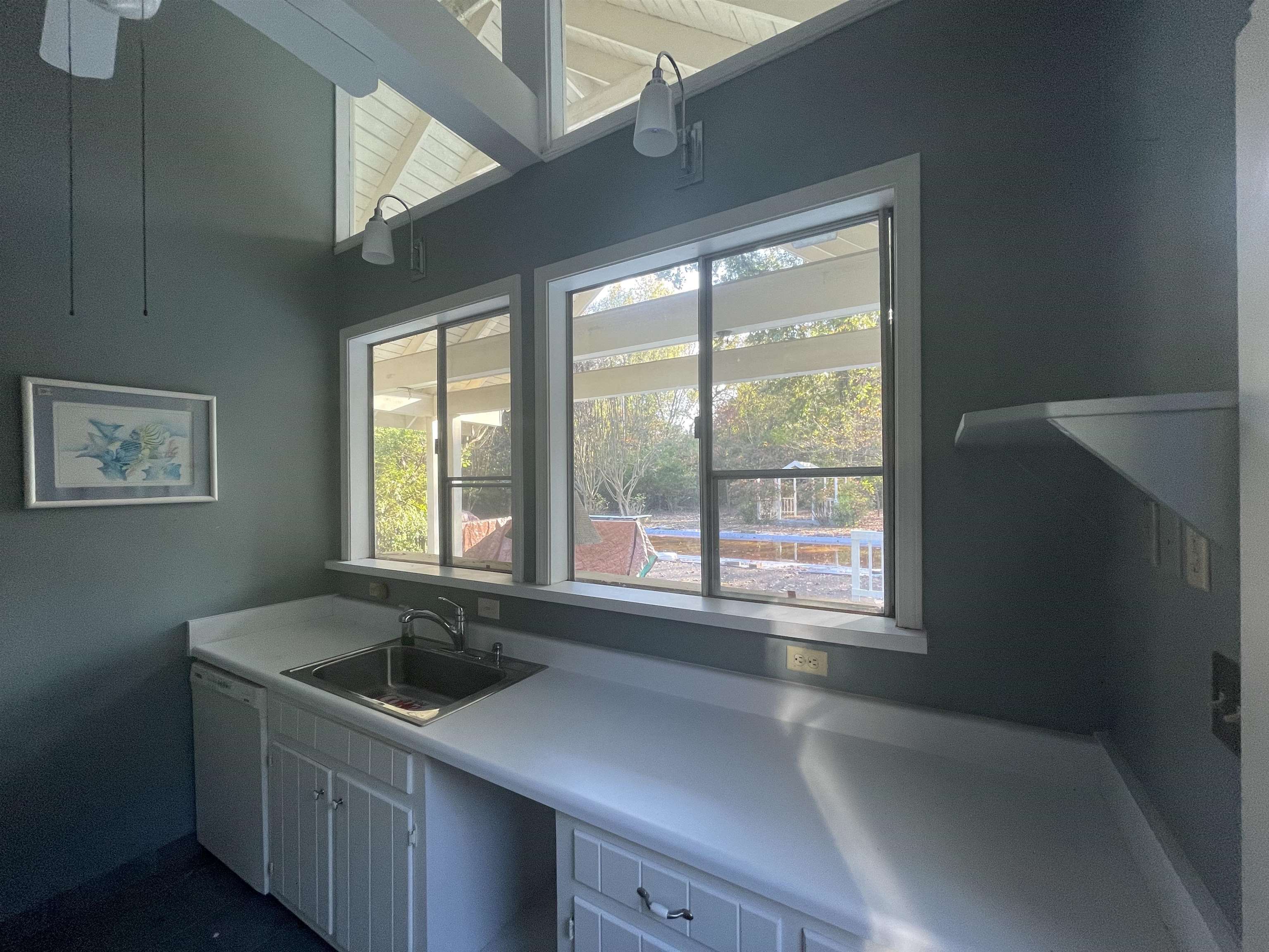4477 Tall Trees Drive Memphis, TN 38117 - Photo 23 of 25 a kitchen with a sink and large window