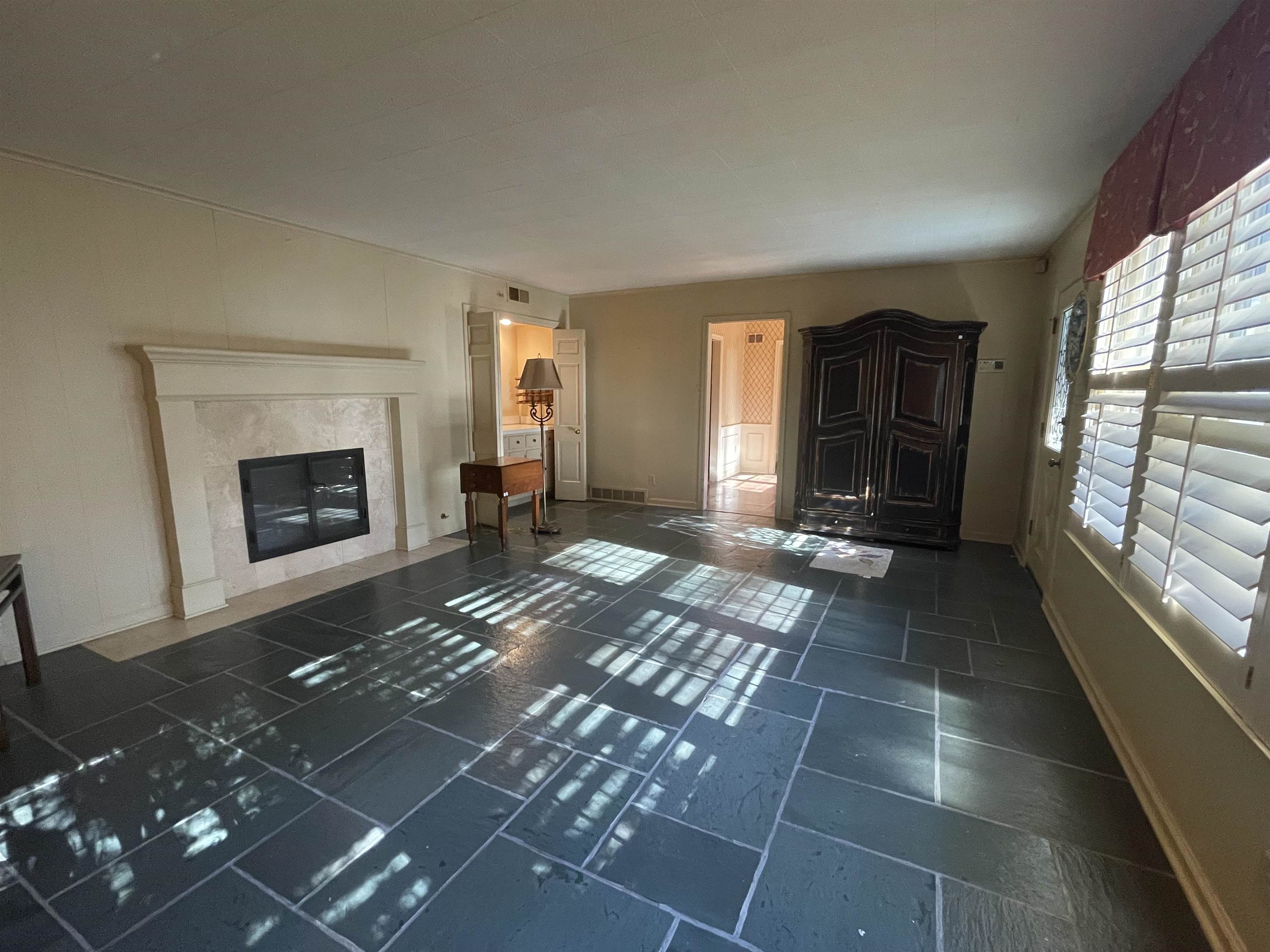4477 Tall Trees Drive Memphis, TN 38117 - Photo 4 of 25 a living room with furniture and a fireplace