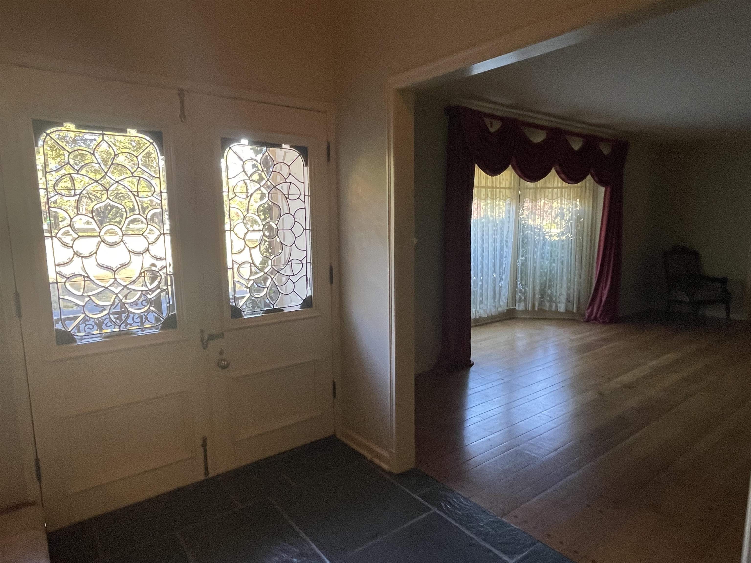 4477 Tall Trees Drive Memphis, TN 38117 - Photo 6 of 25 a view of empty room with wooden floor and fan