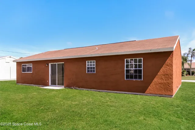 a backyard of a house with lots of green space