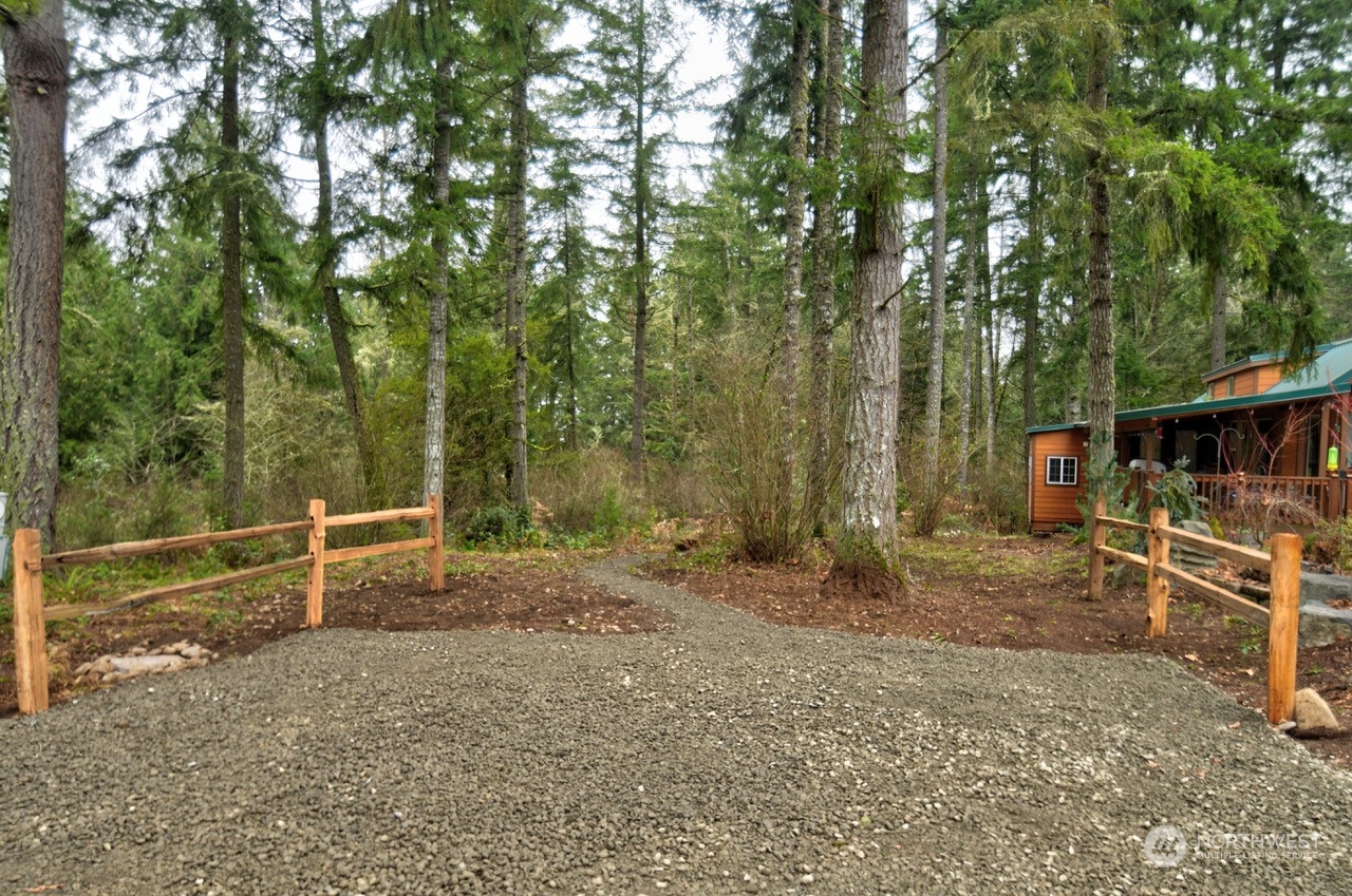 1546 Reservation Road Southeast, Unit 157 Olympia, WA 98513 - Photo 2 of 32 a view of a barn with a large tree