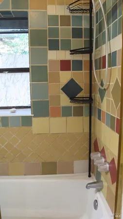 a view of room with window and wooden floor