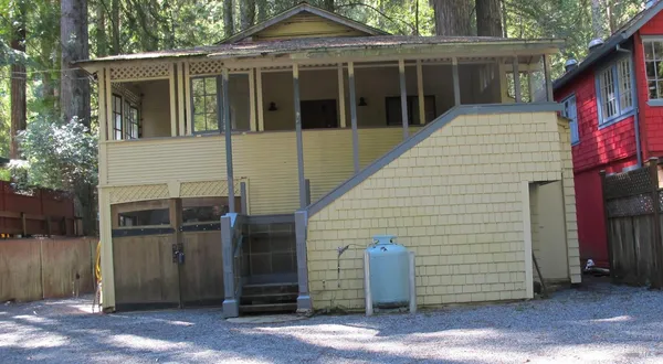 a view of a house with a door and wooden floor
