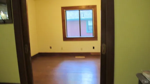 a view of an empty room and window