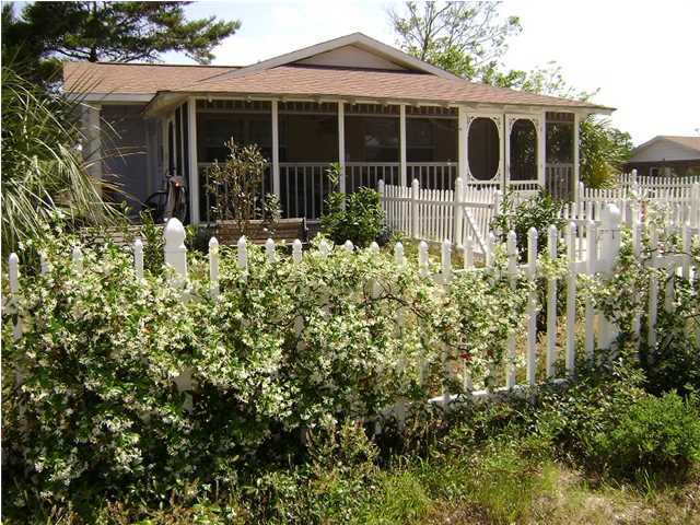 10 Barracuda Street Santa Rosa Beach, FL 32459 - Photo 4 of 14 a view of a house with a small yard and potted plants