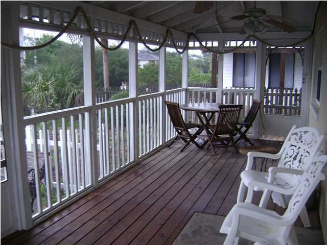 10 Barracuda Street Santa Rosa Beach, FL 32459 - Photo 6 of 14 a view of a chairs and table in patio with wooden fence