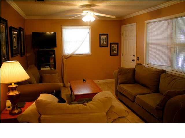 10 Barracuda Street Santa Rosa Beach, FL 32459 - Photo 8 of 14 a living room with furniture and a flat screen tv