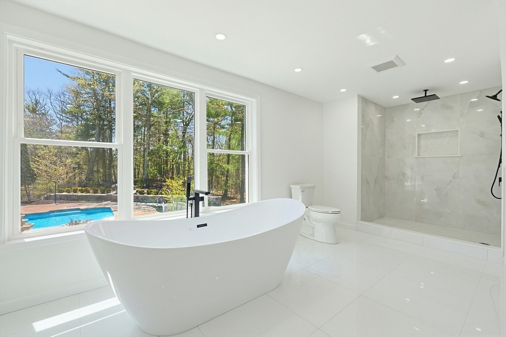 175 Pleasant Street Upton, MA 01568 - Photo 21 of 39 a bathroom with a bathtub and sink
