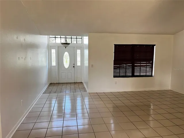 a kitchen with stainless steel appliances granite countertop a stove a refrigerator and a microwave