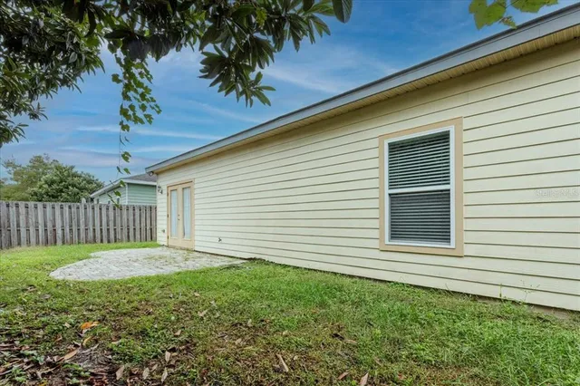 a backyard of a house with a garden
