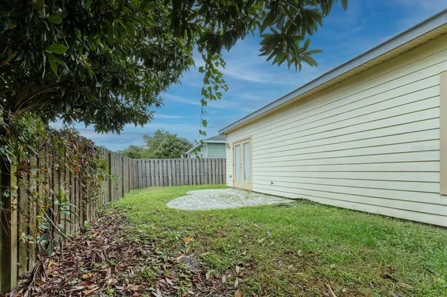 a backyard of a house with lots of green space