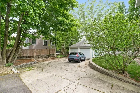 a view of a car parked in front of a house