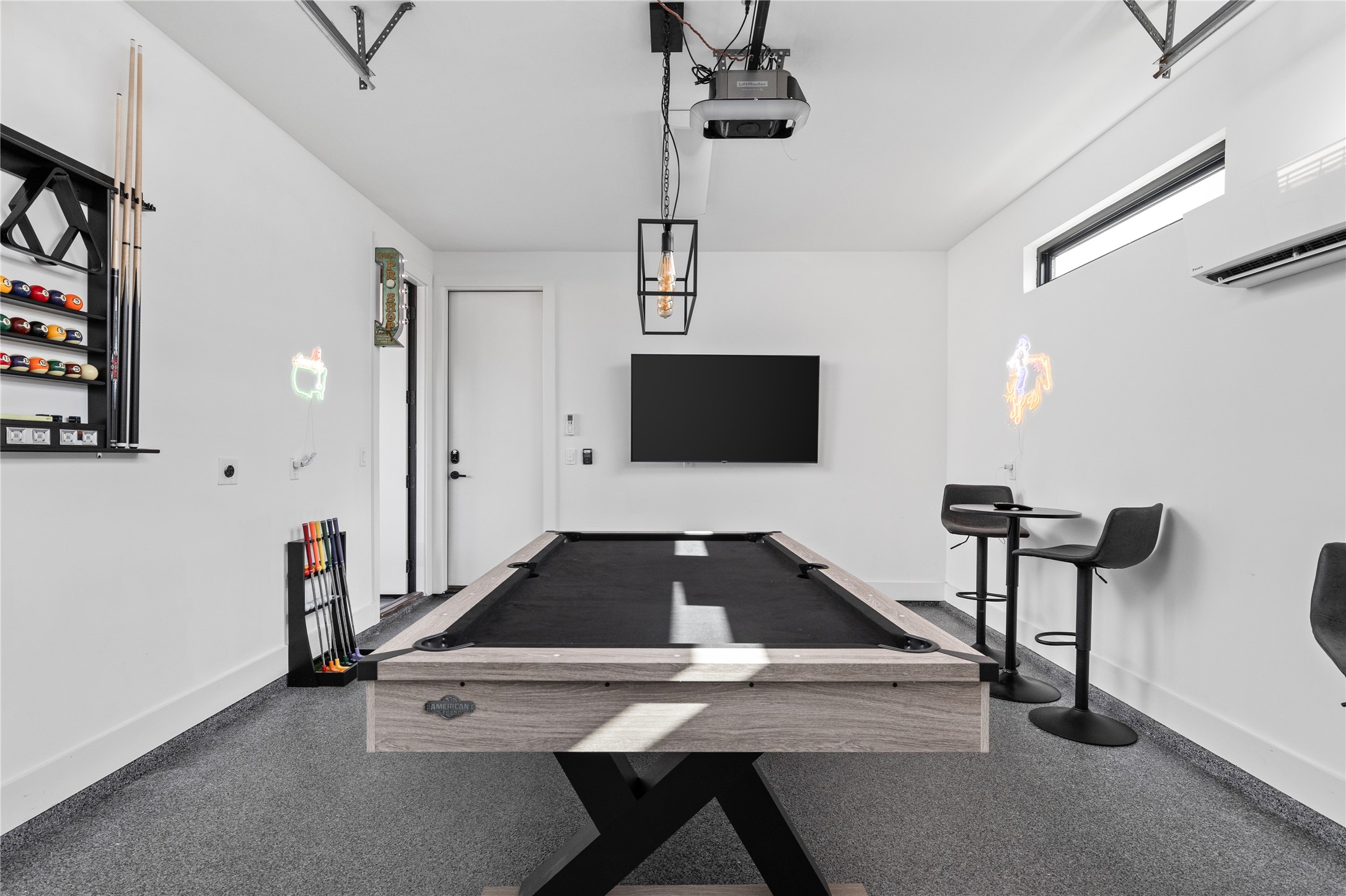 106 Comal Street Austin, TX 78702 - Photo 39 of 40 A game room with a sleek pool table and minimalist decor offers endless entertainment.