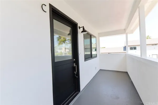 a view of an empty room and a window