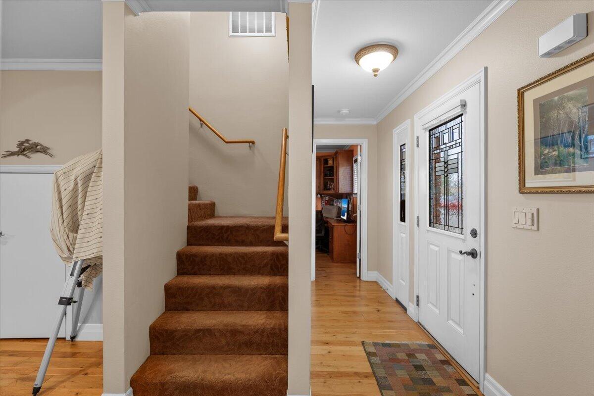 440 Bush Street Central Point, OR 97502 - Photo 9 of 40 a view of a hallway with wooden floor and entryway
