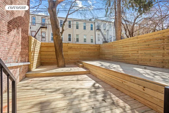 a view of a brick building with many windows