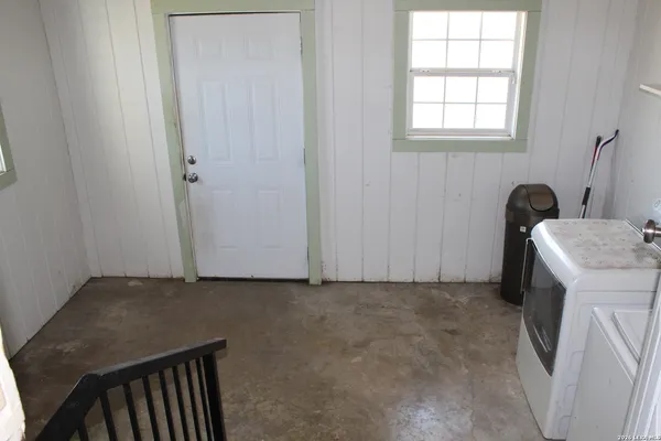 a view of storage and utility room with washer and dryer