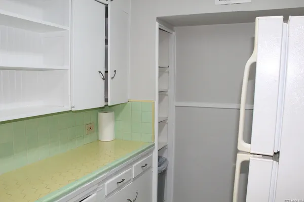 a bathroom with a shower and a sink