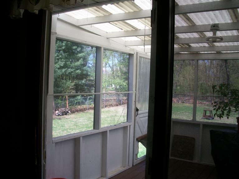 11474 Chateau Lane Demotte, IN 46310 - Photo 8 of 10 a view of a glass door with a yard from a window