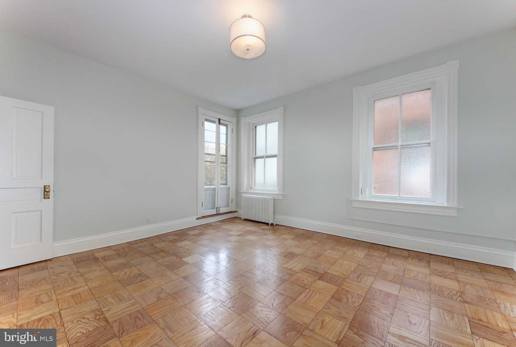 2007 Kalorama Road Northwest, Unit 1 Washington, DC 20009 - Photo 14 of 22 2nd floor bedroom #1.
Bright room with 3 windows