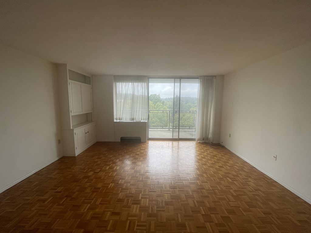 80 Salisbury Street, Unit 806 Worcester, MA 01609 - Photo 12 of 13 wooden floor in an empty room with a window