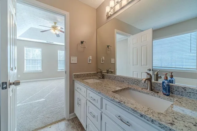 a white bath tub sitting next to a window