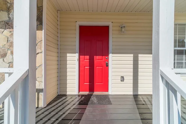 a view of a house with a door and a window